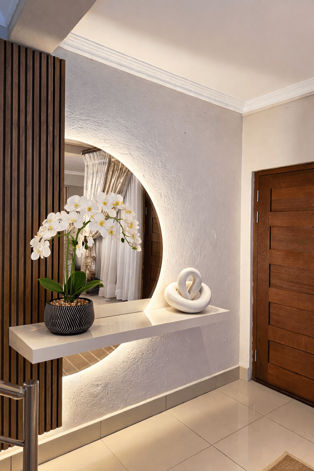 Liquid Blue interior entrance with mirror and orchid display